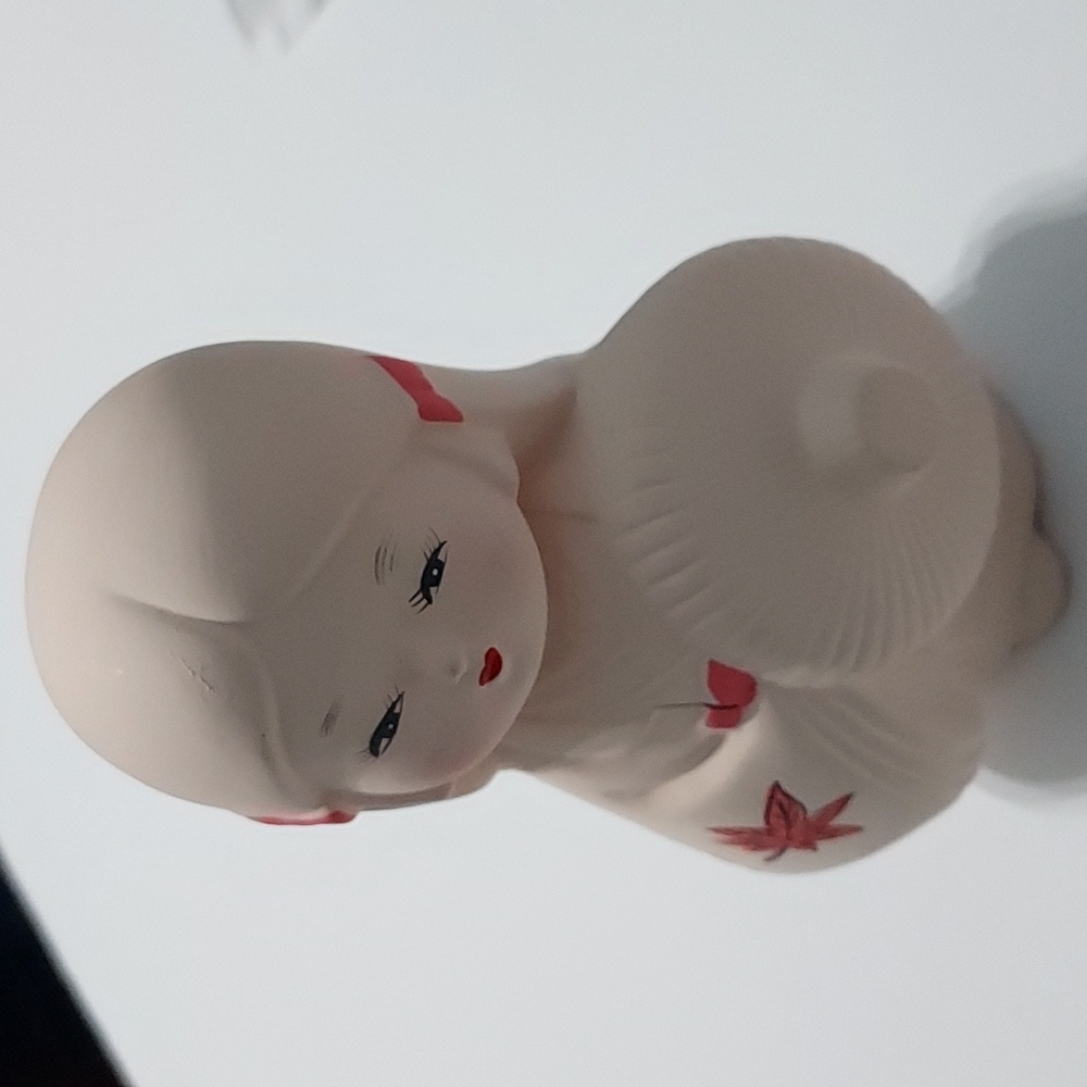 Hakata porcelain bisque doll w/parsol 5 in. Hx4 in.W. Made in Japan Multicolors.